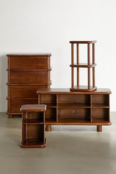 three pieces of furniture sitting on top of a floor