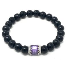 Precious looking black onyx & purple striped agate gemstones bracelets with a platinum plated purple bead• elegant, simple and meaningful! Black Onyx absorbs and transforms negative energy, and helps to prevent the drain of personal energy. Black Onyx aids the development of emotional and physical strength and stamina, especially when support is needed during times of stress, confusion or grief. The 2 piece set includes: 1x 8mm black onyx bracelet 1x 8mm purple striped agate bracelet ** the brac Elegant Round Amethyst Crystal Bracelet, Elegant Round Purple Crystal Bracelet, Elegant Purple Round Crystal Bracelet, Elegant Amethyst Gemstone Crystal Bracelet, Elegant Onyx Beaded Bracelets With Black Beads, Elegant Obsidian Jewelry For Healing, Elegant Silver Stretch Bracelet For Healing, Elegant Amethyst Crystal Bracelet, Elegant Black Amethyst Jewelry