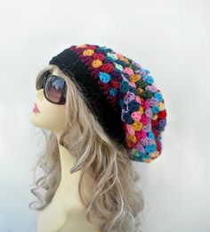 "This is a unique granny style hat made by me with many different colors. This one is slouchier and bigger then other slouchy hats in my shop. It is soft and comfortable. You can wear it with many different color outfits since it has a lot of colors. It is very hip and chic; everyone should have one of these hats in their closet for good or bad hair day! I used at least 15 different colors on this hat. Sizes: One size fits average teen or adult head size of 20\" to 22\". If you are interested in Slouchy Crochet Bohemian Beanie, Slouchy Bohemian Crochet Beanie, Bohemian Slouchy Crochet Beanie, Slouchy Bohemian Beanie Hats, Bohemian Slouchy Knitted Hat, Handmade Slouchy Beanie Crochet Hat, Bohemian Beanie Crochet Hat, Bohemian Knitted Beanie One Size, Multicolor Slouchy Crochet Beanie