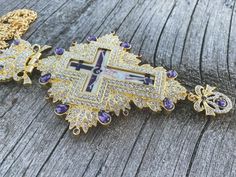 Pectoral Cross Pendant Jesus Priest Bishop Purple Crystallized Stones Devotional clergy Pectoral Cross with small clear crystallized glass elements Purple semi-precious stones.Religious Cross with Jesus enamel image, a long 23" elegant golden chain necklace with closure, worn as a vestment by Orthodox and Eastern Catholic bishops.Clergy Cross pendant length (H X W): 15.5 cm x 8 cm / 6" x 3.5" , Chain Length: 60 cm / 23". Packed in a beautiful gift box with a velvet base to provide extra protecti Cross With Jesus, Golden Chain Necklace, Pectoral Cross, Pearl Rosary, Color Violeta, Religious Cross, Golden Chain, Knight Rider, Gold Cross Pendant