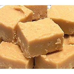 a white plate topped with pieces of brown fudge