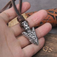 Introducing our Valknut Silver Color Viking Spear Pendant Necklace, a powerful symbol of courage and destiny. Crafted with meticulous detail, this pendant features the iconic Valknut, a revered emblem associated with Norse mythology, intertwined with the classic Viking spear design. Made with high-quality materials, our pendant exudes strength and elegance. Whether you're a devotee of Norse culture, seeking a bold statement piece, or simply drawn to the mystique of Viking symbolism, this necklac Viking Style Metal Necklace For Gift, Viking Style Nickel Free Necklace Gift, Viking Style Nickel Free Necklace For Gift, Viking Style Nickel Free Necklaces For Gift, Viking Style Adjustable Necklace Gift, Viking Style Adjustable Necklace As Gift, Nickel Free Viking Necklaces As Gift, Adjustable Viking Style Jewelry Gift, Nickel Free Viking Pendant Jewelry