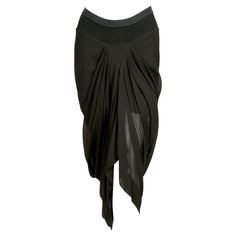 Jet-black, draped silk skirt designed by Rick Owens as seen on the 2007 'wishbone' runway collection. Skirt has a v-shape on the front, draped mermaid-style back and an elasticized waist . Italian size 42 although it fits several sizes due to the elastic waist and draped cut. Approximate measurements unstretched (laying flat): back of waistband 13.5" unstretched (front of skirt dips), hips 32-42" and length 19-40". Fabric content: 93% silk, 4% cotton and 2% viscose. Lined with ribbed skirt (raw Skirts Runway, Rick Owens Runway, Runway Skirt, Silk Runway, Ribbed Skirt, Black Drapes, Draped Skirt, Mermaid Style, Mermaid Fashion