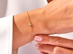 A luxurious addition to any ensemble, this Diamond Bee Bracelet in 14k Gold exudes glamour and sophistication. Featuring a 14k Gold setting and a shimmering Diamond Bee charm, this is the perfect piece for those with a taste for high-end fashion. Features• Made to Order• Gold Kt: 14K• Gold Color: Rose Gold, Yellow Gold, White Gold• Gem Stone: Natural White Diamonds• Diamond Cut: Marquise• Number of Stones: 2• Available Stone Sizes: 2 x 1.50 x 3.00 mm• Total CTW: 0.05 ct• Diamond Color - Clarity: Hand Set Diamond Bracelet Gift, Elegant Diamond Cut Bracelet Perfect As A Gift, Fine Jewelry Bracelets With Diamond Accents For Gifts, Timeless Diamond Cut Chain Bracelet Gift, Timeless Diamond Cut Chain Bracelet As Gift, Elegant Diamond Cut Bracelet As Gift, Elegant Diamond Cut Bracelet For Gift, Timeless Yellow Gold Tennis Bracelet Gift, Yellow Gold Tennis Bracelet As A Gift