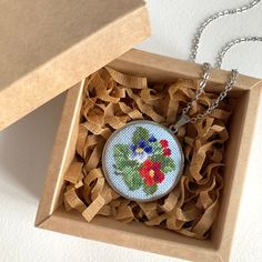 Handmade jewelry necklace with viola flower is a wonderful gift for women. Embroidered pendant with red and a blue flower perfect gift for her best friend, sister or daughter. Delicate flower jewelry perfect for every day and for a special occasion.  This pendant is made in the technique of micro-embroidery cross stitch on cotton canvas with cotton threads.  The size of each stitch is less than 1 mm. MATERIALS: The color of the base and chain-silver (not silver plated), material-stainless steel, Red Flower Pendant Necklace As Gift, Mother's Day Red Flower Pendant Necklace, Blue Violet Flower, Rose Red Flower Pendant Necklace For Gift, Micro Embroidery, Red Bohemian Flower Pendant Jewelry, Bohemian Red Flower Pendant Jewelry, Viola Flower, Embroidered Pendant