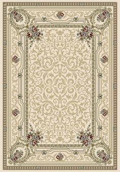 a beige rug with an ornate border