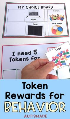 a hand holding a piece of paper with the words token reward for behavior