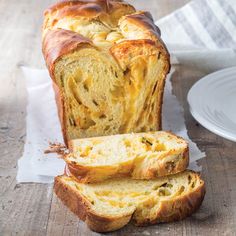 a loaf of bread sitting on top of a wooden table