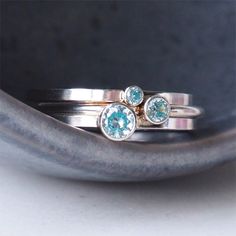 ** Order before 17th December for Christmas Delivery (UK ONLY ) ** MARCH Birthstone Ring in a stackable design. Wear one, wear a few with different sized gems, or mix with other colours of birthstones. - Silver and Aquamarine Blue Gemstone Ring - March Birthstone - Choice of gem size 2mm, 3mm or 4mm - Choice of Band style - Modern Square or fully Round options - 1.5mm wide band, made to your choice of ring size - Sterling Silver - Cubic Zirconia - Handmade in Scotland UK - Gift Boxed in a reusab Silver Stackable Rings With Birthstones, Stackable Round Topaz Ring As Gift, Unique Blue Stackable Jewelry, Unique Stackable Blue Rings, Stackable Round Topaz Ring For Anniversary, Anniversary Stackable Topaz Ring, Unique Stackable Rings With Bezel Setting For Anniversary, Unique Bezel Set Stackable Anniversary Rings, Adjustable Stackable Rings With Stone Setting