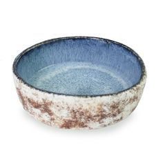 a blue and white bowl sitting on top of a table