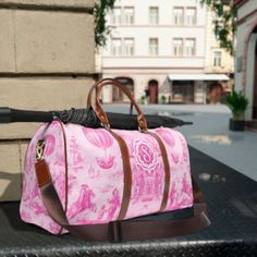 "This PERSONALIZED MONOGRAM TRAVEL BAG is all about your chinoiserie chic style. Made with high-grade waterproof nylon, it's a highly durable means of transferring your essentials wherever you go. With one pocket on the inside, a resilient carrying handle, and an adjustable shoulder strap, it's the perfect companion for all your adventures.PLEASE PROVIDE YOUR MONOGRAM as directed .: High-grade nylon material .: Microfiber PU leather top handle and binding .: One size: 20\" × 12'' × 9\" (50.8cm × 30.5cm × 23cm ) .: Brown PU leather handles and an adjustable shoulder strap .: Polyester lining .: Gold-colored zipper  .: All-over print Key features Additional space-One extra pocket inside bag High-grade nylon-The travel bag is made from high-grade nylon material, making it durable and lightwei Preppy Travel Bags, Pink Chinoiserie, Preppy Travel, Preppy Monogram, Waterproof Travel Bag, Chinoiserie Chic, Inside Bag, Travel Duffel, Duffel Bags