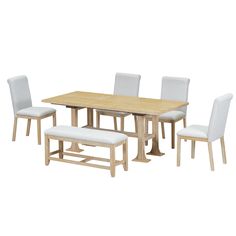 a wooden table with white chairs around it