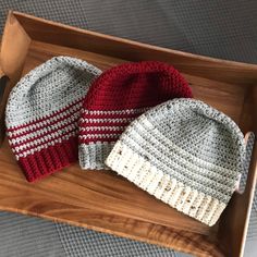 "This cozy unisex hat has a simple, classic design and is available in several color combos. It's one of the first beanies I learned how to make, and I love coming back to it! Color combinations: Cranberry w/ grey stripes Grey w/ cranberry stripes Grey w/ ecru stripes Dimensions: approximately 9.5\" flat across brim, 8\" tall. Fits an adult medium/large." Basic Warm Hat, One Size Fits Most, Camo Yarn, Striped Beanie, Red Beanie, Crochet Patterns For Beginners, Crochet For Beginners, Star Patterns, Grey Stripes, Color Combos