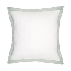 a white pillow with green trim