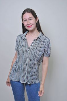 Vintage multicolor striped blouse with short sleeve, Size XL Welcome to TARASCOMMON.ETSY.COM Unique clothing from the 20th century. Model tall - 170cm. Size: XL. Sleeve - 2cm/ 0.7inch; Width - 43-70cm / 16.92-27.55inch; Length - 65cm / 25.59inch. All measurements are taken seam to seam while lying flat. Polyester. This item is vintage, so it can have some defects. Additional photos can be send We are glad that you are interested in lots that we sell. Wish you a good shopping! FOLLOW US : Instagram: https://www.instagram.com/olena_vintage Casual Vertical Stripes Button-up Blouse, Casual Collared Blouse With Vertical Stripes, Casual Striped Short Sleeve Blouse, Summer Short Sleeve Blouse With Striped Collar, Blue Blouse With Striped Collar And Short Sleeves, Multicolor Short Sleeve Top With Striped Collar, Multicolor Short Sleeve Tops With Striped Collar, Spring Vertical Stripes Short Sleeve Shirt, Striped Short Sleeve Shirt For Spring