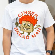 a man wearing a ginger bread shirt holding a knife and fork