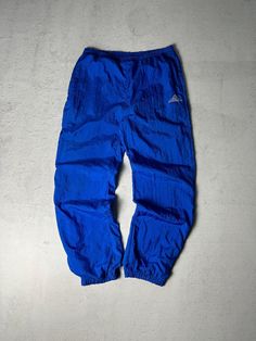 Vintage Mens Track Pants, NFL Cuffed Track Pants, Blue Track Pants, Gift For Him - Men's Large Size On Label: Large Recommended Size: Men's Large Measurements: Waist: 34" - 40" Inseam: 30" Mens Track Pants, Blue Track Pants, Pants Gift, Pants Blue, Mens Trousers, Track Pants, Gift For Him, Large Size, Labour Day