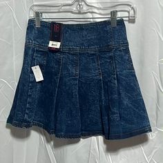 The No Boundaries Denim Pleated Skirt Is Fun, Flirty And Playful, All While Being Seriously Soft And Comfy. With A High-Rise Waist And No-Gap Waistband, This Mini Skirt Will Accentuate And Flatter The Waistline. But The Real Mvp In This Style In Your Leg! With A Mini Skirt Length Complete With Pleats, This Piece Is Designed To Show Off. Stretchy, Comfortable, Easy To Wear, And Cute. Pair With Sneakers For A Casual And Cool Look. Material: 100% Polyester Care: Machine Washable Country Of Origin: Denim Pleated Skirt, Pleaded Skirt, Double Belt, Skirt For Women, Pleated Mini Skirt, No Boundaries, Skirt Length, Pleated Skirt, Boundaries