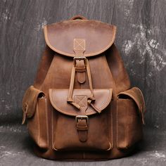 Vintage Leather Backpack College Backpacks School Backpack Model Number: 8891M Dimensions: 12.2"L x 5.9"W x 15.7"H / 31cm(L) x 15cm(W) x 40cm(H) Weight: 4lb / 1.8kg Hardware: Brass Hardware Shoulder Strap: Adjustable & Removable Color: Vintage Brown / Brown / Dark Coffee / Black Features: • Genuine Natural Leather• Inside 1 Wallet Pocket, 1 Cell Pocket, 1 Zipper Pocket.• YKK Zipper• Adjustable Shoulder Strap• Can fit a 14" Laptop Full Grain Leather Bag, Leather Travel Backpack, Vintage Leather Backpack, Handmade Leather Backpack, Leather Backpack For Men, Large Travel Bag, Brown Leather Backpack, Hiking Bag, Vintage Backpacks