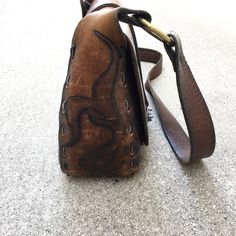 "Beautiful Vintage 60s or 70s Saddle Leather Handbag Purse Great Vintage Condition with Amazing Patina - unique hardware, and leather stitching, inside leather pocket Rough Measurements: Width: 10 1/2\" Length (the bag itself not including strap or ring handles): 9\" Depth (slightly Stretched): 4\" Will ship out between 1-3 business days once the payment has been made. Please message me w/ any questions. All sales final. And please check out my other vintage shirts!! thank you!" Retro Leather Flap Bag For Daily Use, Retro Leather Rectangular Flap Bag, Retro Leather Flap Bag Rectangular, Retro Leather Flap Bag For Everyday Use, Vintage Brown Crossbody Flap Bag, Retro Vintage Brown Leather Bags, Hand Tooled Satchel Saddle Bag For Travel, Hand Tooled Saddle Bag Satchel For Travel, Retro Brown Saddle Bag Satchel