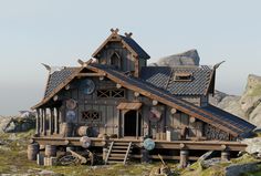 a house made out of wood and stone on the side of a rocky hill with mountains in the background