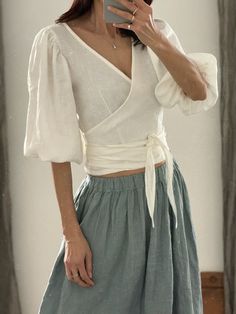 "* 100% washed linen  * 3/4 puff sleeve * The belt is attached to the blouse * Handmade in Slovakia Measurements in cm/inches:  --------------------------- Size XS / US size (4) Recommended body measurements in cm/inches: Bust: 81cm/32\" - 84 cm/33\" Waist: 65 cm/25,5\" - 68 cm/27\" Hips: 84 cm/33\" - 87 cm/34\" Length (from the neckline to the hem, measured from the back - total length): 58 cm/ 23\" --------------------------- Size S / US size (6) Recommended body measurements in cm/inches: Bust: 85/33,5\" -88/34,5\" Waist: 69/27\" - 72/28,5\" Hips: 88/34,5\" - 91/36\" Length (from the neckline to the hem, measured from the back): 58 cm/23\" --------------------------- Size S/M / US size (8) Recommended body measurements in cm/inches: Bust: 89/35\" - 92/36\" Waist: 73/28\" - 75/29,5\" Hip Bohemian Linen Blouse For Brunch, Summer Linen Blouse With Puff Sleeves, Linen Puff Sleeve Top For Brunch, Fitted Linen V-neck Wrap Top, Fitted Linen Blouse For Brunch, Fitted Linen Wrap Top, Spring Fitted Linen Wrap Top, Fitted Linen Wrap Top For Spring, Fitted Linen Wrap Blouse