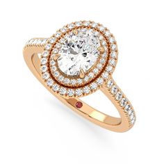 an oval shaped diamond ring with two rows of diamonds on the band, set in yellow gold