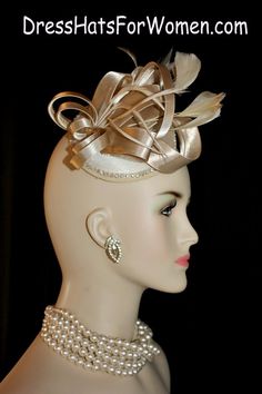 Champagne Beige Satin Wedding Fascinator Cocktail Hat For Women. Couture Bespoke 1920's Flapper Era Designer Fashion Hat - Trimmed With A Large Looped Champagne Beige Satin Bow, Accented With Delicate Beige Feathers, Embellished With A Beautiful Row Of  Rhinestones. This Satin Wedding Fascinator Is Held In Place By An Ali gator Hair Clip. This Is A Beautiful Headpiece For A Bride Or Wedding Guests. Also Suited For Mother Of The Bride Or Groom.

Measurements: The Fascinator Satin Base Measures 13 Elegant Gold Top Hat For Formal Occasions, Fitted Bridal Accessories For Royal Ascot Party, Party Bridal Hat Accessories, Elegant Gold Fitted Top Hat, Elegant Fitted Wedding Headpieces, Gatsby Style Wedding Hat And Headpieces, Gatsby Style Wedding Headband Hat, Elegant Gold Top Hat For Royal Ascot, Gatsby Style Costume Hat For Wedding