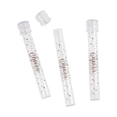 three clear plastic tubes with the word candy on them and two small white tube holders