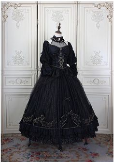 This Black Gothic Lolita Lace Wedding Dress With Corset Plus Size is a stunning alternative to a traditional white wedding dress. This dramatic and unique dress features a full-length black lace overlay with a corseted bodice and sweetheart neckline. The bodice is adorned with intricate silver embroidery, giving it a luxurious feel. The full-length skirt has a slight train and is finished off with a bow detail at the waist. The corset back allows for an adjustable fit to ensure you are comfortab Black Wedding Dress Corset, Gothic Dress Elegant, Gothic Ballgown, Victorian Gothic Dress, Black Victorian Dress, Traditional White Wedding, Vampire Lady, Goth Wedding Dresses, Wedding Dress With Corset