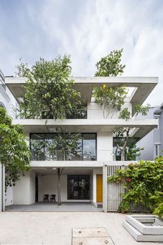 an apartment building with many balconies and trees