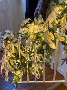 the stairs are decorated with garland and lights