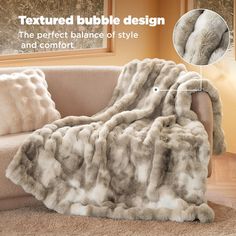 an image of a couch that has a blanket on it and the text, textured bubble design