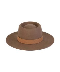 A new dipped crown boater style. In cool Coffee Brown, trimmed with genuine suede band. A structured and stiff short brimmed boater style. Vintage Classic Boater in Coffee Brown Trimmed with Brown tonal soft 100% genuine suede band 100% soft Australian wool Brim measures 8 cm / 3.15” Classic crown height Spot / specialist clean Unisex style This hat is accredited with a UPF Rating 50+ (Australian Tested) Size + Fit: Style fits true to size Women Fedora, Cool Coffee, The Mirage, Rancher Hat, Candle Canvas, Lack Of Color, Boater Hat, Brown Trim, Brown Coffee