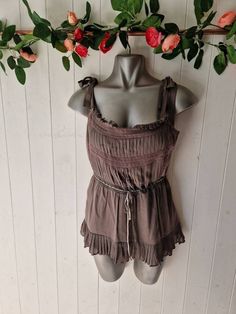 "Gorgeous taupe brown silk camisole tilop in Silk, by Whistles  Size UK14 US10 Very good condition  Manequin size UK8 for ref Zip side Gathered waist with ribbon and lace Rouching and self tie shoulder straps Measurements: taken flat  Pit to pit 18\" Waist 15\" Length 22\" All orders are shipped using biodegradable and recycled packaging where possible" Brown Tops With Adjustable Straps For Summer, Bohemian Sleeveless Top With Tie Straps, Elegant Brown Summer Camisole, Brown Sleeveless Top With Lace Trim, Elegant Brown Sleeveless Camisole, Elegant Brown Tank Top For Summer, Stunning Tops, Silk Camisole, Brown Silk