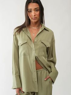 Collared Snap buttons Large front pockets Wide cuffs Loose fit Model measurements: Height 5’8”, Bust 34”, Waist 26”, Hips 36” | Wearing a Small. Drawstring Waist Pants, Wide Cuff, Western Shirts, Button Downs, Set Dress, Button Up, Dress Skirt, Fitness Models, Jumpsuit Romper