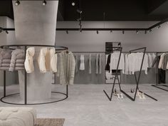 a clothing store with clothes hanging on racks