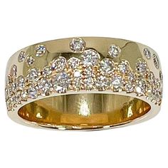 14k yellow gold wide .90 CTW diamond band. Ring has round diamonds varying is size, has a width of 6.9 mm, measures to be a size 7, and has a weight of 7.3 grams. Diamond Band Ring, Diamond Band, Diamond Bands, Band Ring, Round Diamonds, Band Rings, Jewelry Rings, Size 7, Yellow Gold