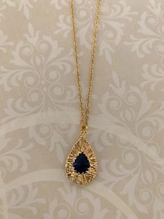 "Stunning, unique and expensive looking double-sided dainty navy-blue zircon stone and gold tone nest look teardrop necklace, dark blue necklace, dark blue pendant, dark blue jewelry, gold wire necklace, navy blue necklace, navy gift Pendant measures 7/8\" L X 1/2\" W.   ★ Want to see more?  Please visit my shop at: https://www.etsy.com/shop/DesignsByPeg" Sapphire Teardrop Pendant Jewelry, Blue Teardrop Gold Plated Jewelry, Dark Blue Necklace, Navy Blue Necklace, Dark Blue Jewelry, Aqua Pendant, Red Flower Necklace, Aqua Necklace, Aqua Jewelry