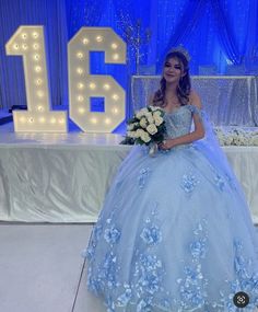 Make your quinceanera celebration magical with this Sky Blue 3D Applique Off-Shoulder Ball Gown Quinceanera Dress. The classic ball gown is crafted from delicate tulle, creating a voluminous and graceful look fit for a princess. The off-the-shoulder neckline enhances the romantic allure, framing your shoulders beautifully. The intricate 3D appliques adorn the gown, adding texture and artistry to its ethereal design. The corset back ensures a flawless fit, giving you both support and style as you Sweet 16 Blue Dresses, Baby Blue Sweet 16, Sky Blue Long Dress, Sweet 16 Dresses Blue, Sky Blue Quinceanera Dresses, Light Blue Long Dress, Baby Blue Quinceanera, Light Blue Quinceanera Dresses, Cinderella Quinceanera Themes