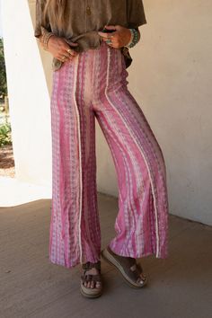 Effortlessly Cool and boho-chic you're never going to want to take the Walk The Line Wide Leg Pants off and they are the perfect addition to your wardrobe from this season to the next! Flowy, lightweight woven fabric with an eye-catching geometric striped print Relaxed and loose wide leg silhouette with a so CUTE trim center seam Flattering high-rise elastic waistband Unique mini bottom front slits for added style Pair with: Audra Waistband Loop Lace Bralette,Shirr Delight Puff Sleeve Top and Co Hippie Boho Print Vacation Bottoms, Summer Vacation Boho Print Bottoms, Boho Print Hippie Pants For Vacation, Hippie Boho Print Pants For Vacation, Vacation Hippie Pants With Boho Print, Vacation Boho Print Hippie Pants, Bohemian Style Relaxed Fit Bottoms, Bohemian Boho Print Pants For Vacation, Bohemian Relaxed Fit Harem Pants