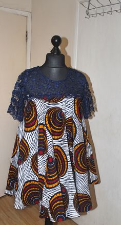 This is a  vibrant handmade short flared dress with lace detail. This dress has pockets - stylish and practical, perfect for all  occasions.  Currently available in two sizes. Size: UK10 Size: 14 - 16UK Feel free to send me a message if you have any questions. Ankara Flared Dress Styles, Short Flare Dress Ankara, Short Dresses Ankara Styles, Ankara Free Gown Styles For Women Short, Free Short Ankara Gown Styles, Ankara Free Short Gown Styles, Ankara Flare Dresses Short, Lace Short Dress Styles, Free Gown Styles For Women