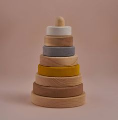 a stack of wooden toys on top of each other