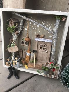 a miniature house made out of wood and other items