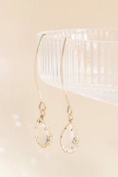 These glass teardrop hook earrings are the perfect addition to your bahcelorette going-out look. Shop our jewelry collection today. Make an entrance anywhere with these fun, dangly hook earrings with gorgeous glass teardrops. Wear them with your bridesmaid dress or with a chic-casual outfit for a bachelorette brunch. | Jewelry | Birdy Grey Chambers Glass Drop Earrings Elegant Glass Drop Jewelry, Elegant Drop Glass Jewelry, Elegant Drop-shaped Glass Jewelry, Elegant Dangle Glass Jewelry, Elegant Glass Drop Earrings, Elegant Glass Dangle Jewelry, Elegant Clear Teardrop Crystal Earrings, Dainty Crystal Drop Earrings For Party, Elegant Glass Crystal Drop Earrings