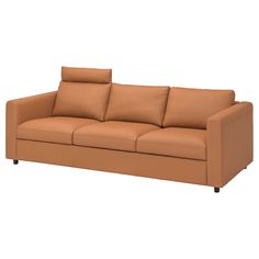 an image of a couch with pillows on the top and bottom part in tan leather