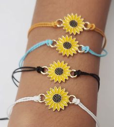 This cute bracelet with a bright sunflower charm can double as an anklet. Made with cotton thread and an adorable sunflower charm with an easy slide knot. 100 % of the profit from the sale of this item will be donated to UNICEF. Flower Friendship Bracelets For Beach, Cute Adjustable Friendship Bracelets For Summer, Adjustable Yellow Sunflower Design Jewelry, Cute Adjustable Yellow Friendship Bracelets, Casual Gold Friendship Bracelets For Spring, Yellow Adjustable Friendship Bracelets As Gift, Yellow Adjustable Length Jewelry For Beach, Adjustable Flower Friendship Bracelets For Summer, Yellow Adjustable Friendship Bracelets For Beach