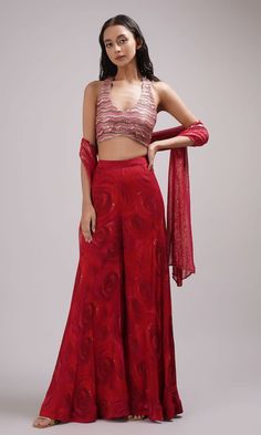 Red halter neck crop top with sequin embroidery. Paired with a rose print sharara and dupatta. - Aza Fashions Crop Top Indian Outfit, Plazo Top Indian, Crop Top Plazo Dress, Party Sets With Red Resham Embroidery, Red Palazzo Set With Zari Work For Reception, Elegant Red Anarkali Set With Unstitched Blouse, Red Resham Embroidered Palazzo Set For Reception, Elegant Red Sets With Unstitched Blouse, Red Georgette Sharara With Unstitched Blouse