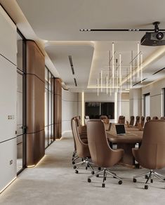 a large conference room with chairs and lights on the ceiling is lit by recessed lighting