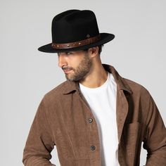 Features: Brim Size: 2.75" 100% wool Size: Men's s/m: 58cm, l/xl: 60cm Wool felt cowboy hat with embossed faux leather trim and studs Casual Leather Fedora For Rodeo, Casual Leather Fedora With Short Brim, Leather Fedora Hats For Rodeo, Western Style Leather Fedora With Flat Brim, Western Leather Fedora With Flat Brim, Leather Brimmed Fedora For Rodeo, Brown Leather Fedora For Fall, Western Style Fur Felt Fedora With Flat Bill, Leather Fedora For Rodeo With Short Brim